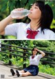 A woman in a school uniform drinking water from a bottle.